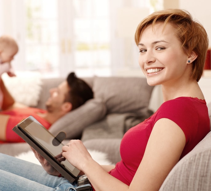 A person browsing on a tablet at home on a private connection